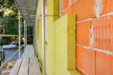 View at unfinished thermal wall of unfinished residential building, insulation material, rock wool